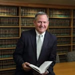 Clic para ver perfil de Law Office of James K. Champion, PLLC, abogado de derecho penal - federal en Ada, MI